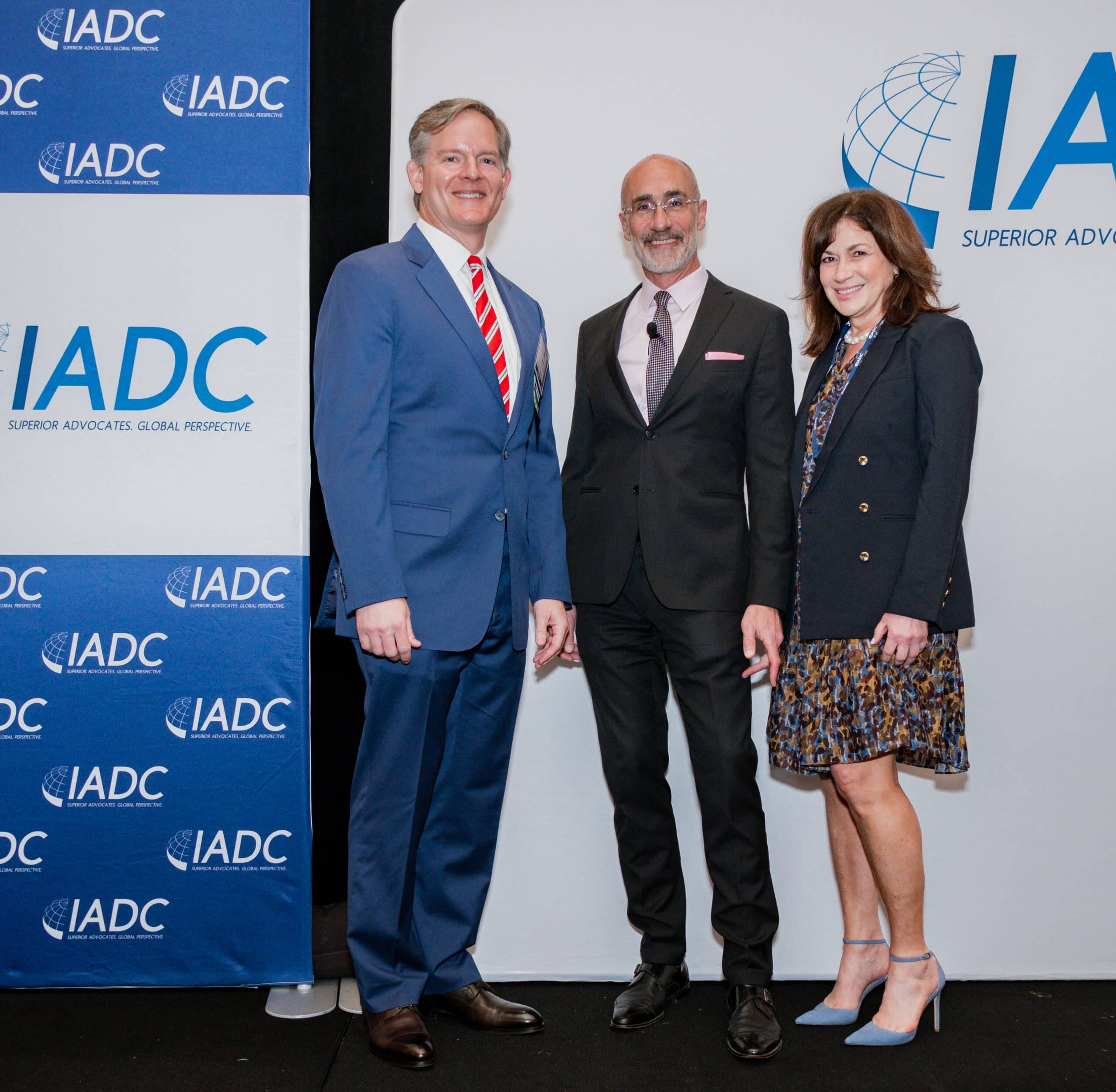 Foundation Forum speaker Arthur Brooks stands with Foundation Board Member Edward Sledge and IADC President Michele Smith